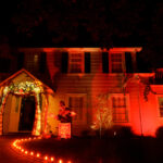 House decorated for Halloween with Large Jack in the Box and Ora